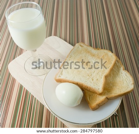 Cuisine and Food, Delicious Homemade Brown Toast with Boiled Eggs and Milk for Breakfast.