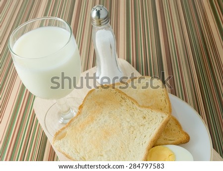 Cuisine and Food, Breakfast with Delicious Homemade Brown Toast, Boiled Eggs and Milk.