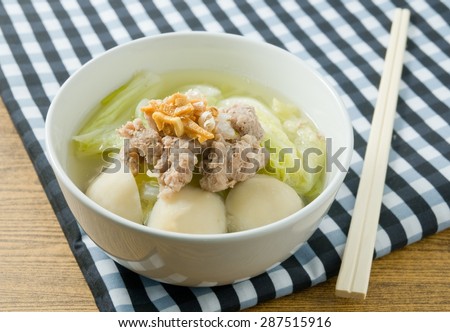 Thai Cuisine and Food, Bowl of Delicious Chinese Cabbage with Minced Pork and Fish Meat Ball Soup Topping with Fried Garlic.