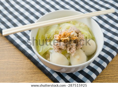 Thai Cuisine and Food, A Bowl of Chinese Cabbage with Minced Pork and Fish Meat Ball Soup Topping with Fried Garlic.