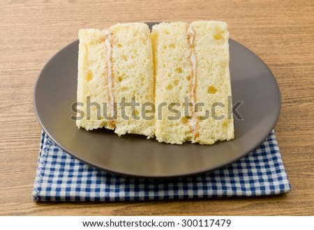 Snack and Dessert, Vanilla Chiffon Cake Made With Butter, Eggs, Sugar, Flour, Baking Powder and Flavorings on White Dish.