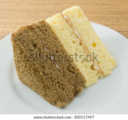 Snack and Dessert, Vanilla and Coffee Chiffon Cake Made With Butter, Eggs, Sugar, Flour, Baking Powder and Flavorings on A White Dish.