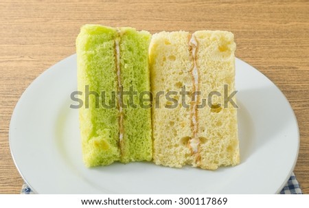 Snack and Dessert, Pandan and Vanilla Chiffon Cake Made With Butter, Eggs, Sugar, Flour, Baking Powder and Flavorings on A White Dish.