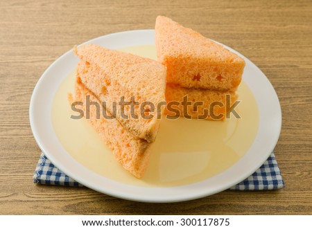 Snack and Dessert, Orange Chiffon Cake Made With Butter, Eggs, Sugar, Flour, Baking Powder and Flavorings on A Dish.