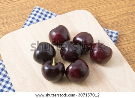 Fresh Fruits, Ripe and Sweet Red Plums A Very Good Source of Vitamin C on A Wooden Cutting Board.