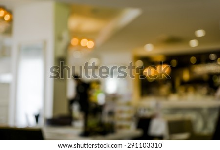 Cafe bar interior with lamps defocused background