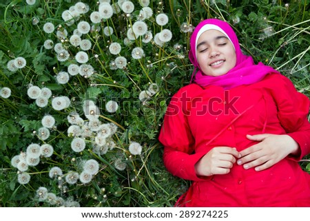 Arabic Muslim beautiful girl in green nature