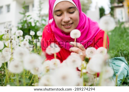 Arabic Muslim beautiful girl in green nature