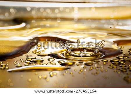 Water splash on gold plate