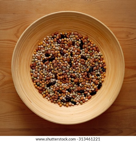 Bamboo Bowl with Various Kind of Legumes on Wood Background