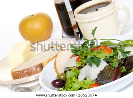 Salad with french bread, an asian pear, and french pressed coffee for lunch