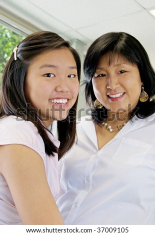 Teen girl and mother enjoying their time together, focus on daughter