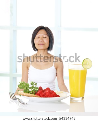 Woman feeling gratitude for health, prosperity, and fresh food