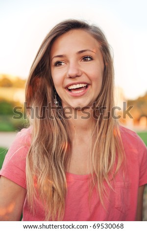 stock photo Pretty teen girl laughing and having fun outdoors