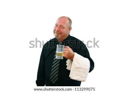 Bartender or waiter with a pleasant expression holding a half full mug of beer isolated on white.