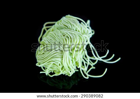 Jade noodle, vegetable noodles, green noodles on Black background.