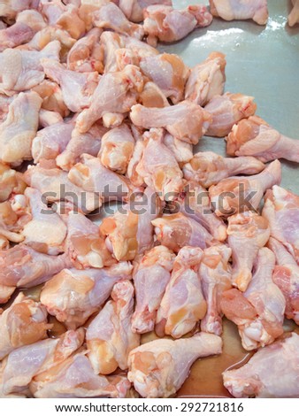 Fresh raw chicken legs on tray