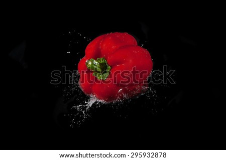 Colorful bell pepper vegetable on black background