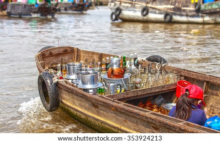Can Tho, Vietnam - April 5th, 2015: sell coffee shop on river with cups coffee, cook warm coffee, utensils making coffee all boat to sell to farmers on market morning floating in Can Tho, Vietnam