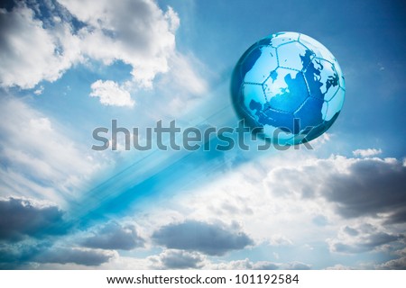 Map of the globe on a blue leather football shooting in the sky