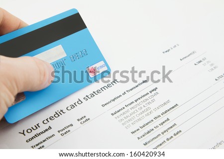 A Credit Card on top of a fake Bank Statements