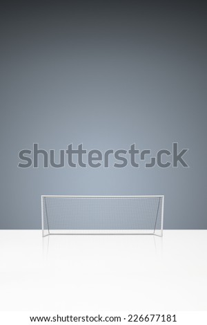 football concept showing empty football goal posts with goal net and space for text