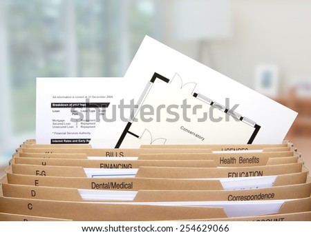 home filing dividers showing mortgage statements & house floor plan