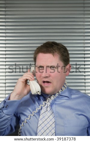 Caucasian Businessman busy and stressed Shouting down the telephone,