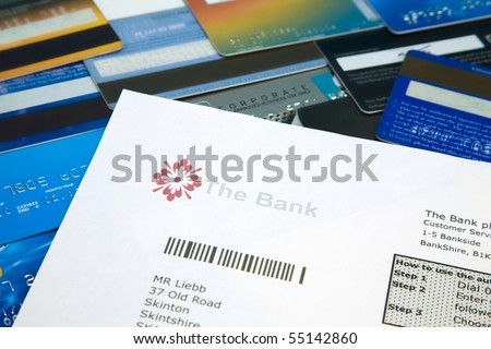 Fake bank statement on top of a selection on bank and credit cards