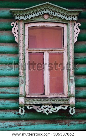 Old vintage window on a green house