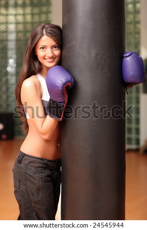 The beautiful girl in boxing gloves.