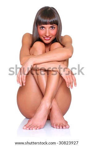 stock photo Beautiful naked girl sits having pressed to itself of a foot