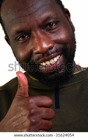 stock photo Happy black man shows the big finger of a hand isolated on