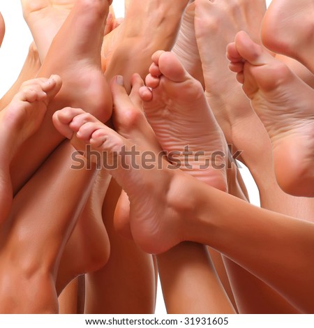 Beautiful female slim feet of group of girls, isolated on a white background, please see some of my other parts of a body images