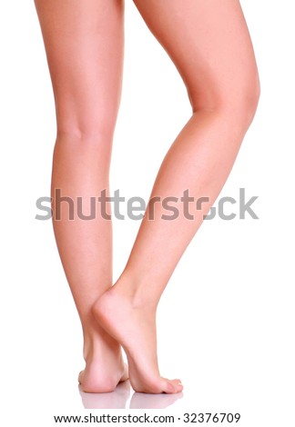 stock photo Beautiful graceful female feet isolated on a white background