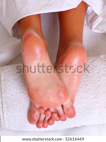Well-groomed heels of female feet after processing of a skin by