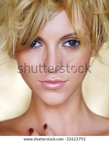 Gold portrait the naked woman with light hair. Sight in an objective