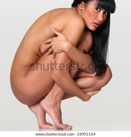 stock photo Scared naked girl squats having embraced itself