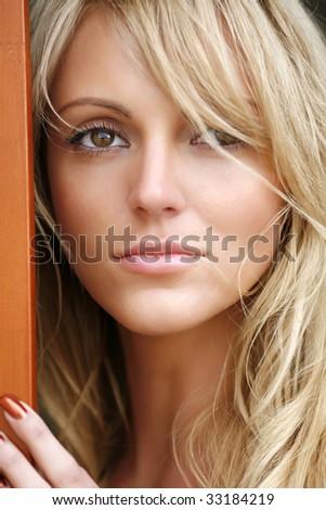 Portrait of the beautiful young woman with magnificent light hair, close up