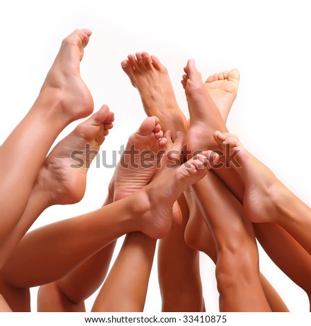 stock photo Beautiful female slim feet of group of girls isolated on a stock photo Beautiful female slim feet of group of girls isolated on a