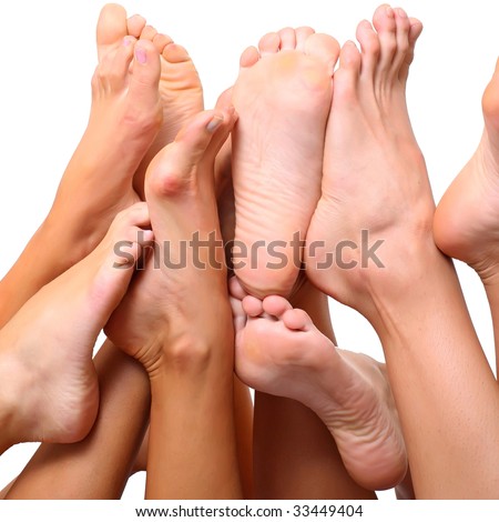 stock photo Beautiful female slim feet of group of girls isolated on a 