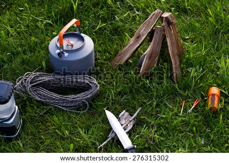 Lighting the fire at a campsite for cooking and making tea or coffee