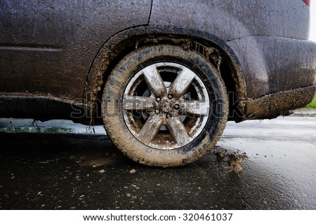 Off-road tire covered with mud