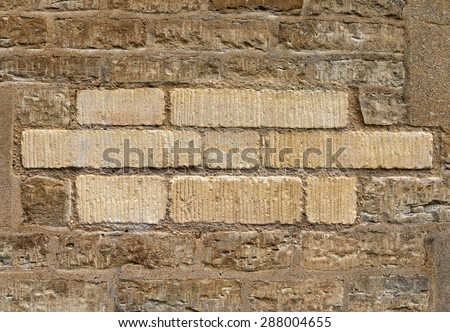 Sandy bricks in the wall.