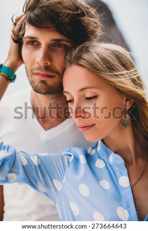 young stylish hipster couple in love on tropical beach during vacation honey moon, embrace, lovely, romance, tenderness, blue dress