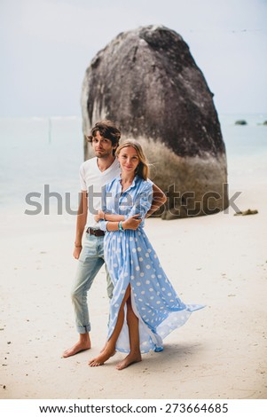 young stylish hipster couple in love on tropical beach during vacation honey moon, embrace, lovely, romance, tenderness