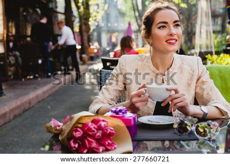 young stylish woman, fashion sunglasses, sitting in cafe, holding drinking cup cappuccino, tulips, happy birthday party, city street, boho outfit, europe vacation, romantic dinner, sunny, smiling