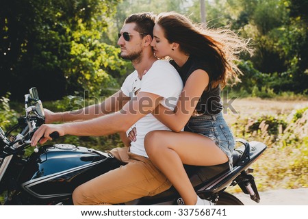 young couple in love, riding a motorcycle, hug, passion, free spirit, vintage, hipster, romantic, tropic vacation, honey moon, cool outfit, modern style, wind in hair, sexy denim, sunglasses, tan skin