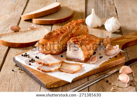 Salo, cured pork fat ,bacon on a wooden board. Traditional Ukranian dish