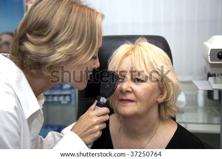 doctor,examining a patient in ophthalmology laboratory